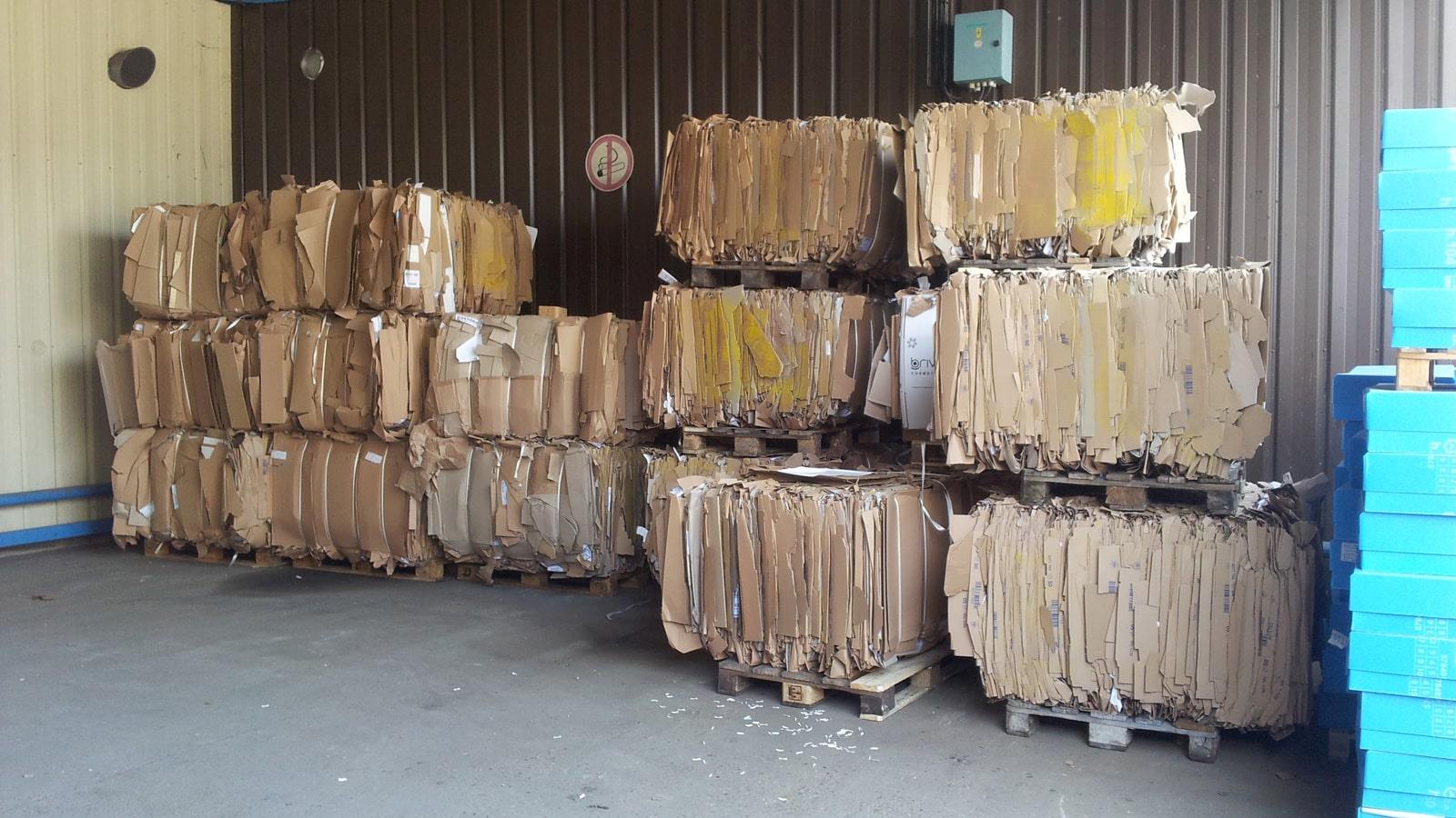 Cardboard bales stacked until collection in Cosmeva warehouse