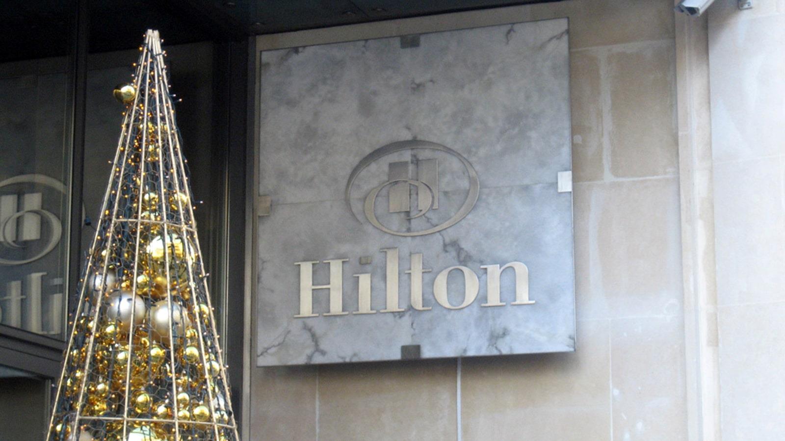 Christmas tree decorated with golden balls at Hilton Hotel entrance