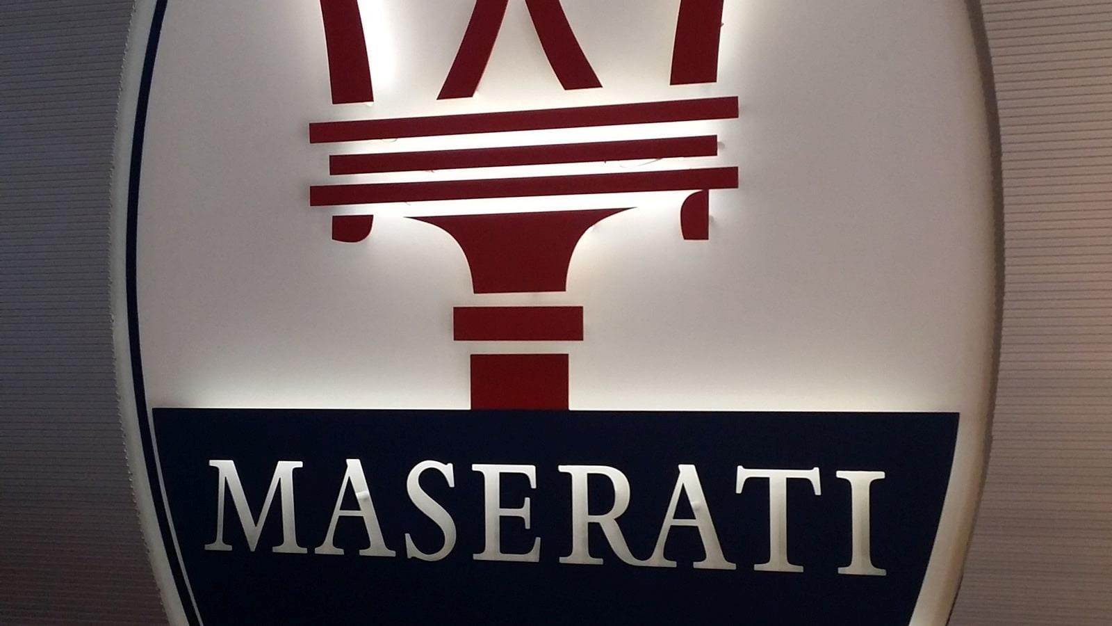Plate with Maserati logo on the wall